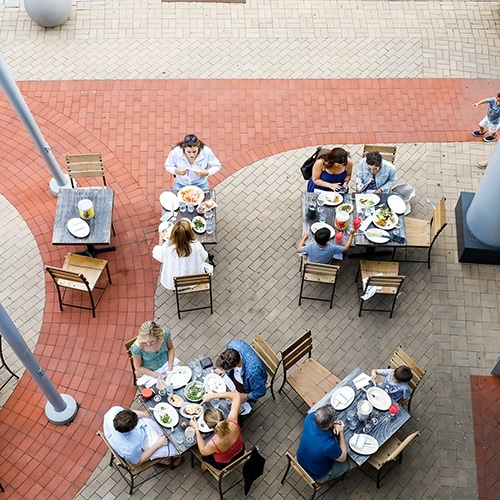 Overhead view of patrons enjoying outdoor seating at a restaurant