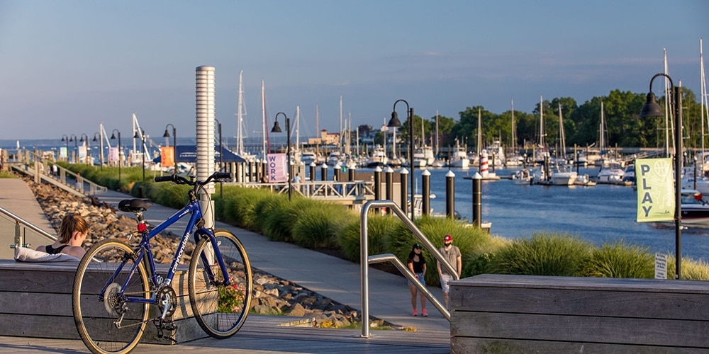 Bike at the top of a stairwell overlooking a marina