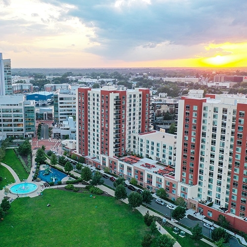 Aerial view of multi-story apartment buildings with courtyard