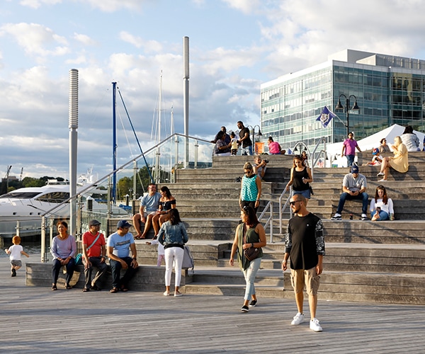 Bike at the top of a stairwell overlooking a marina